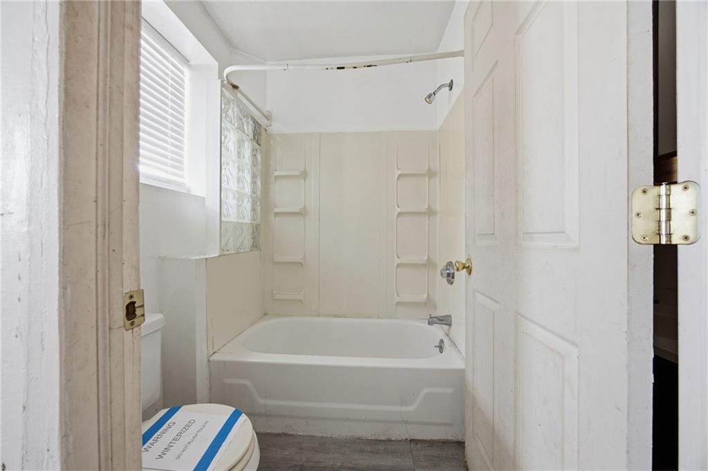1450 Fleming Avenue McKees Rocks, PA 15136 - Photo 7 of 29 a bathroom with a bathtub and a shower