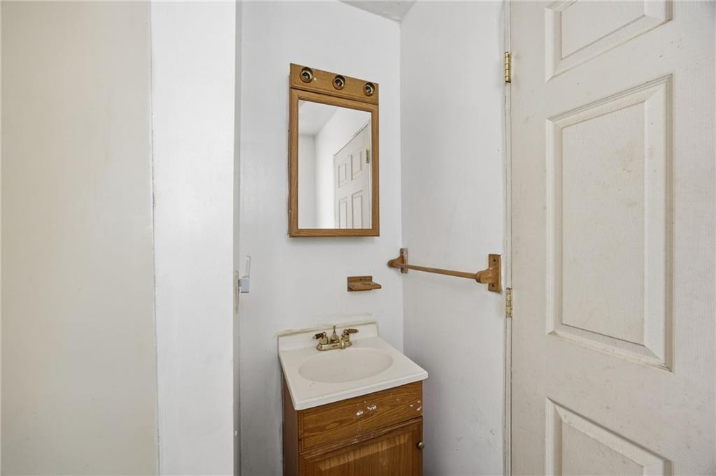 1450 Fleming Avenue McKees Rocks, PA 15136 - Photo 8 of 29 a bathroom with a sink toilet and mirror