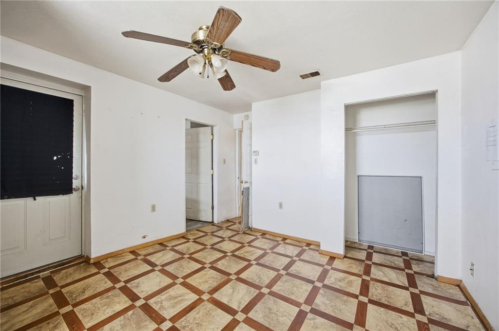 1450 Fleming Avenue McKees Rocks, PA 15136 - Photo 10 of 29 a bedroom with a bed and a chandelier fan