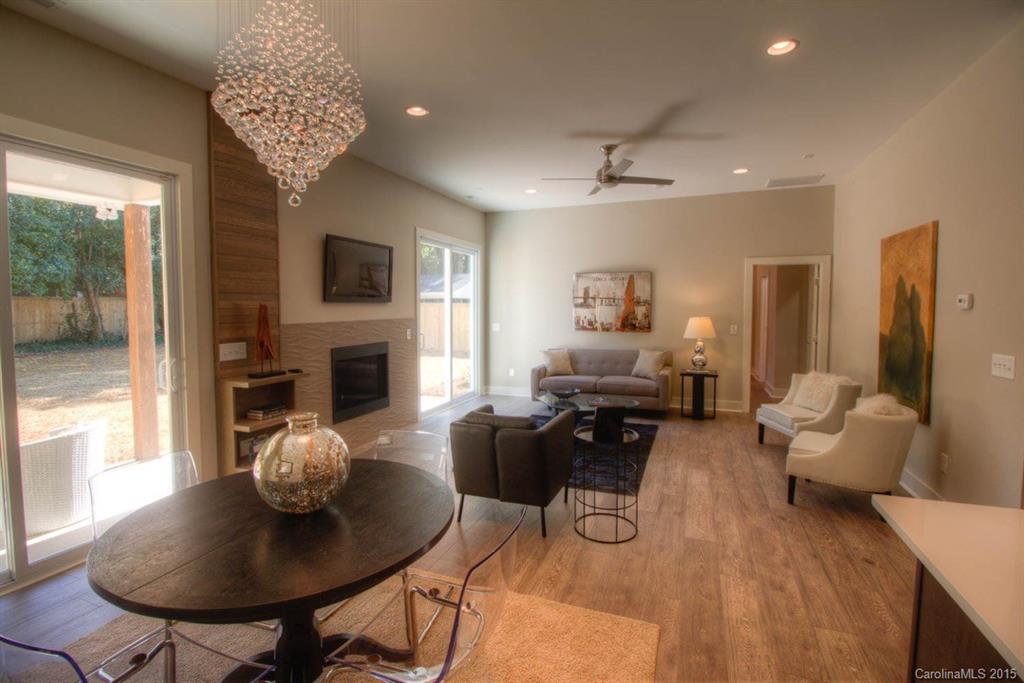 1632 Longfellow Street Charlotte, NC 28205 - Photo 6 of 24 a living room with furniture and a fireplace