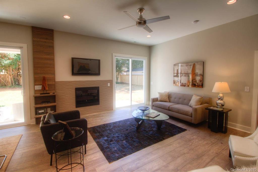 1632 Longfellow Street Charlotte, NC 28205 - Photo 7 of 24 a living room with furniture and a fireplace