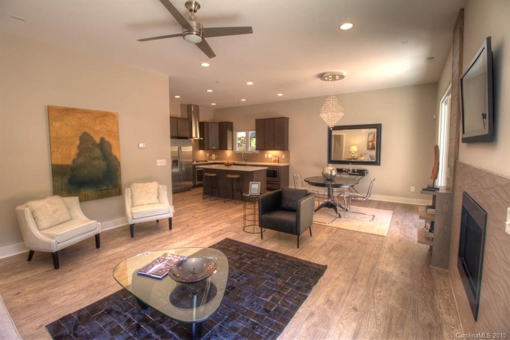 1632 Longfellow Street Charlotte, NC 28205 - Photo 8 of 24 a living room with furniture and a fireplace