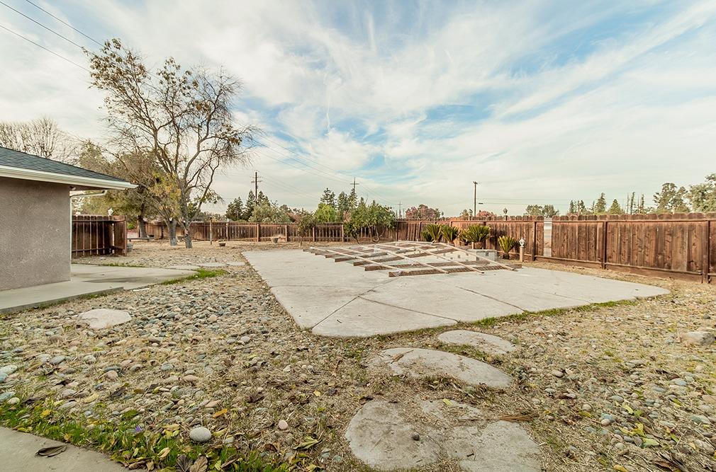 5662 North McCall Avenue Clovis, CA 93619 - Photo 24 of 34 a view of road with large trees