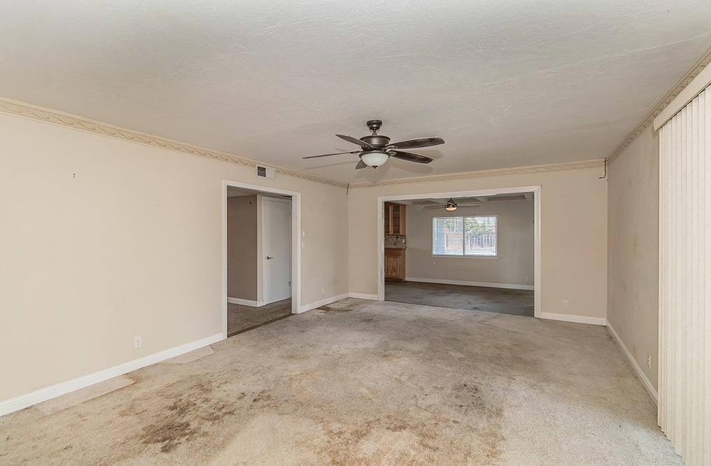 5662 North McCall Avenue Clovis, CA 93619 - Photo 4 of 34 a view of an empty room with a window