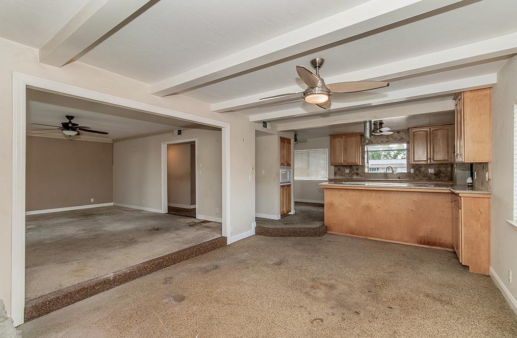 5662 North McCall Avenue Clovis, CA 93619 - Photo 6 of 34 a view of kitchen with stainless steel appliances granite countertop a sink and cabinets