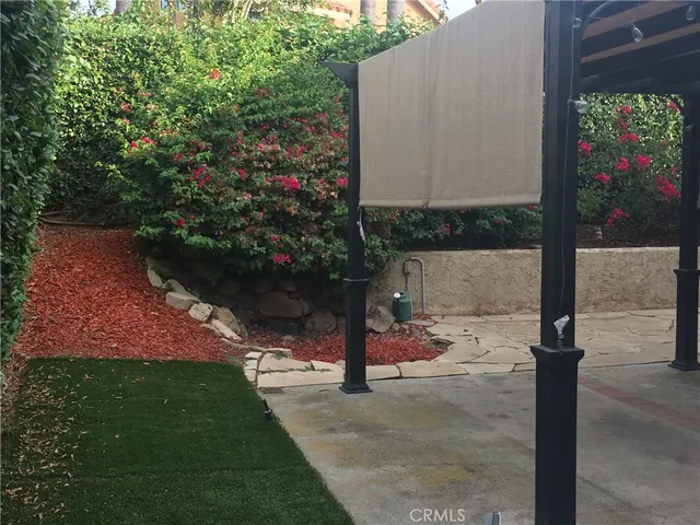 a view of yard with patio