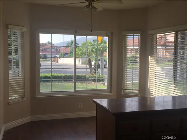 a room with windows and pool table