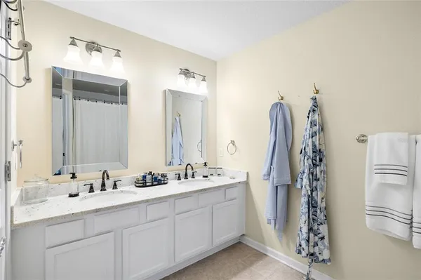 a bedroom with a bed and a mirror