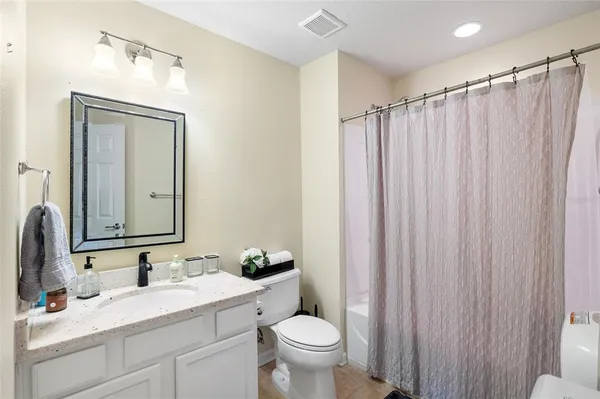 a work room with furniture and a large window