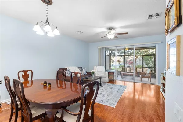 a view of a hallway with wooden floor and front door