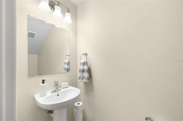 a kitchen with a sink a stove and refrigerator