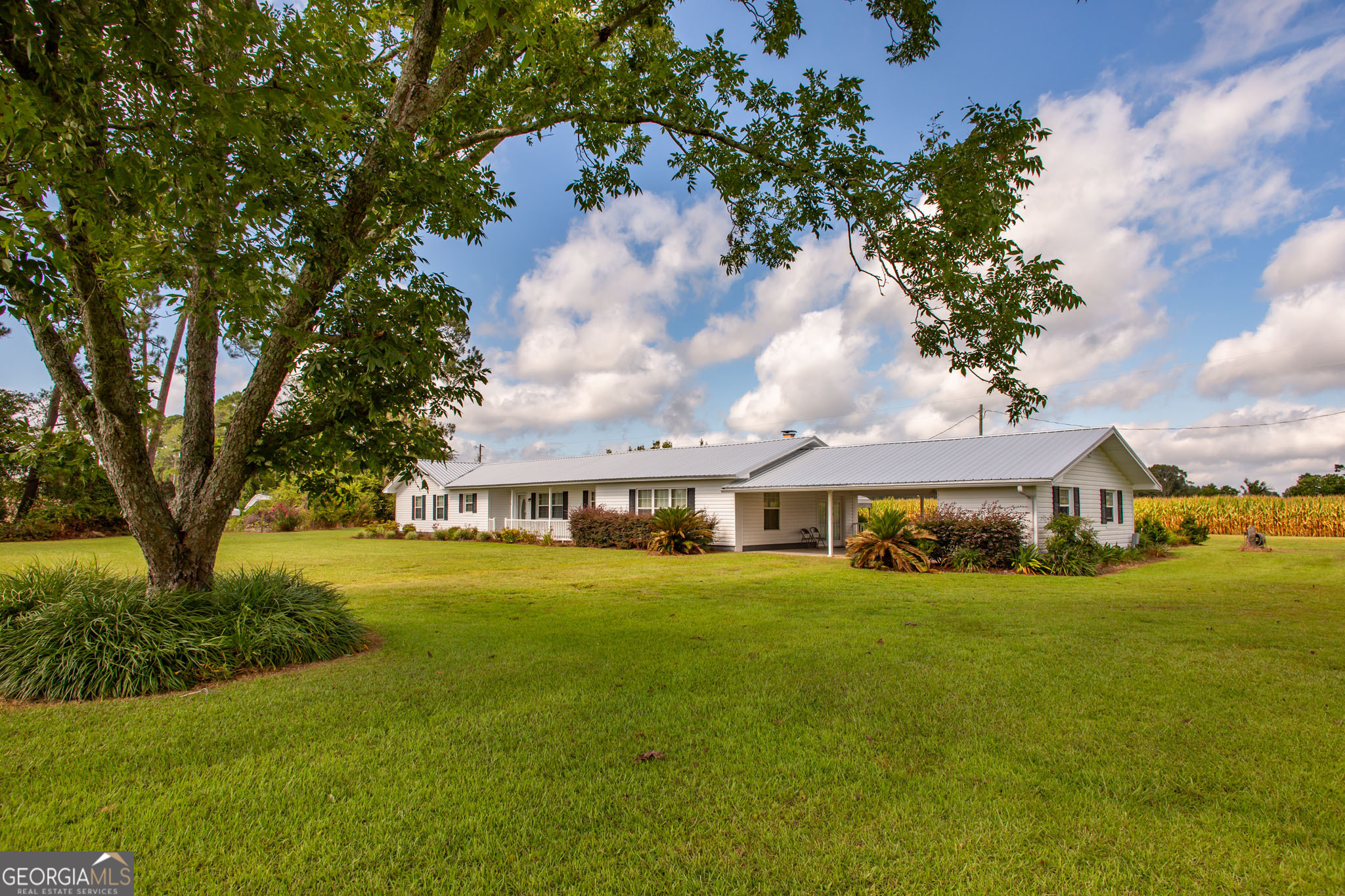 a view of a house with a big yard