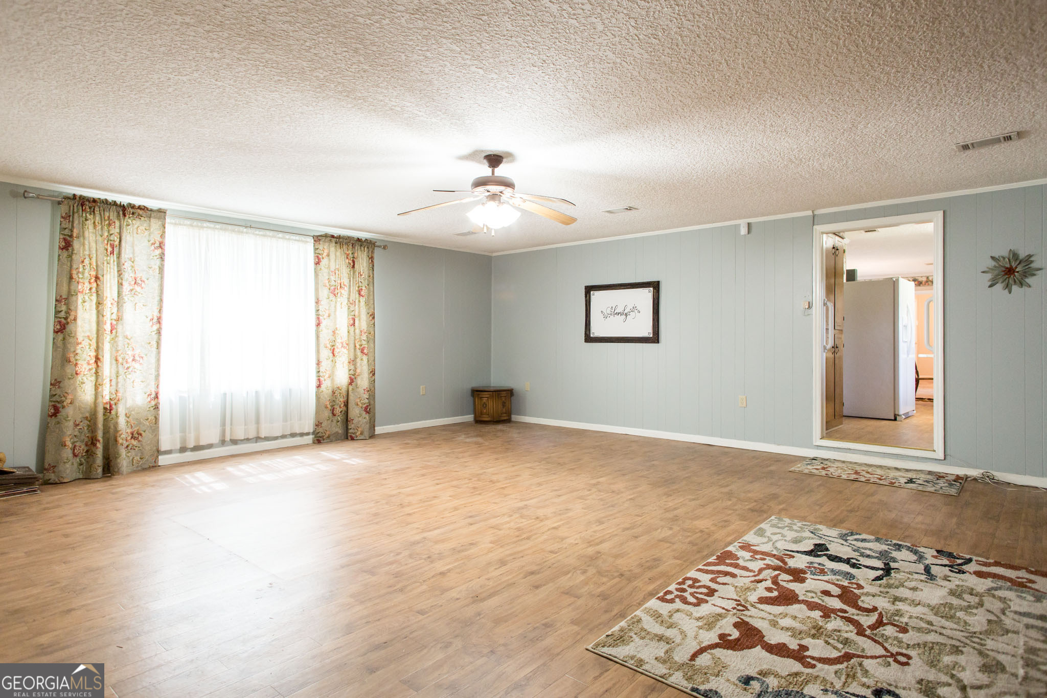 596 Teakwood Road Alma, GA 31510 - Photo 21 of 54 a view of an empty room with a window