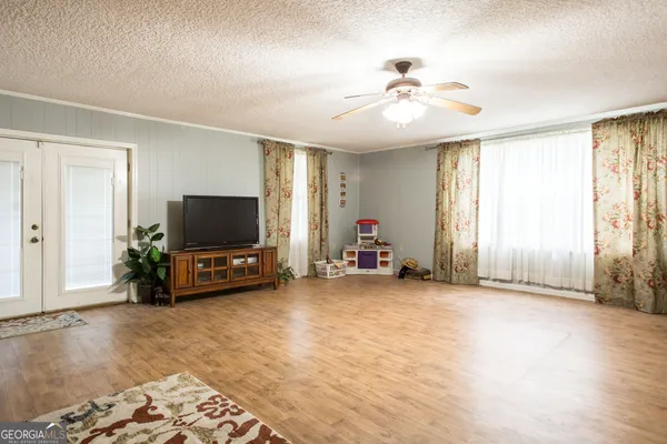 a living room with a sink and a table