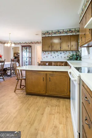 a large dining space with furniture window and wooden floor