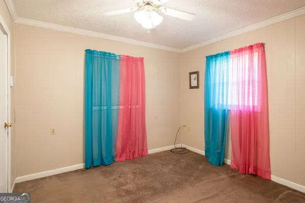 a view of a hallway with bathroom