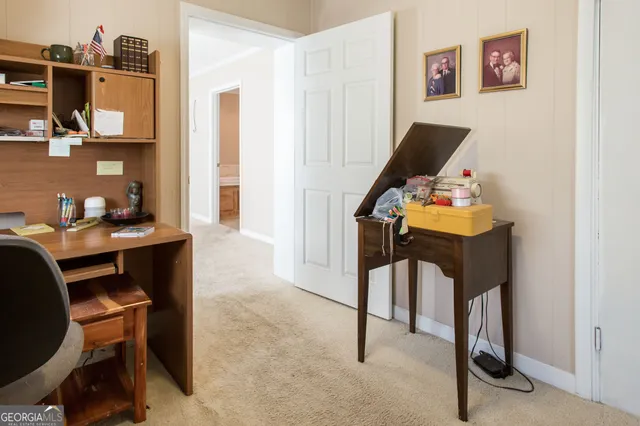 a spacious bathroom with a granite countertop sink a toilet and a bathtub