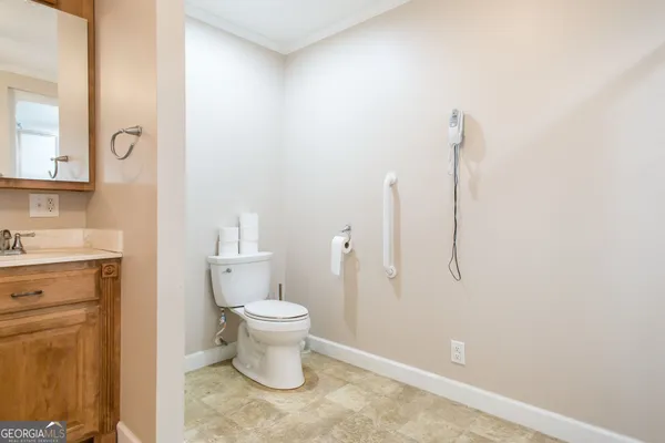 a spacious bathroom with a sink a mirror and a bathtub