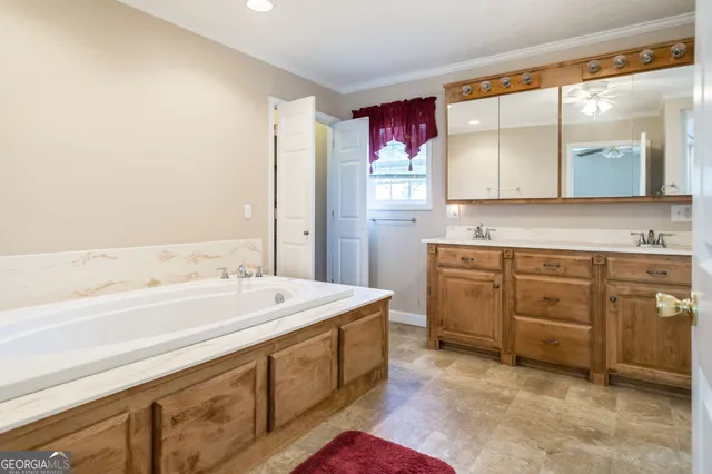 a view of a swimming pool with a lawn chairs under an umbrella