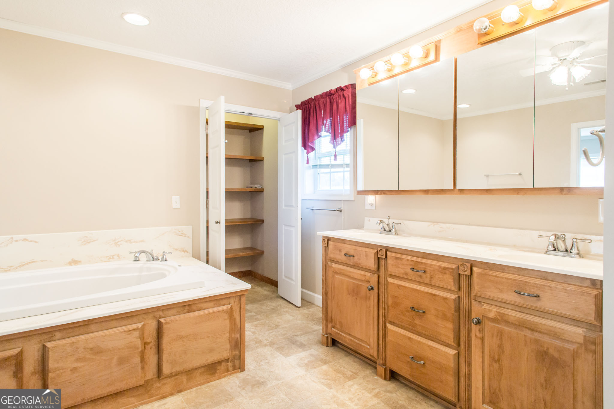 596 Teakwood Road Alma, GA 31510 - Photo 43 of 54 a spacious bathroom with a sink double vanity and granite