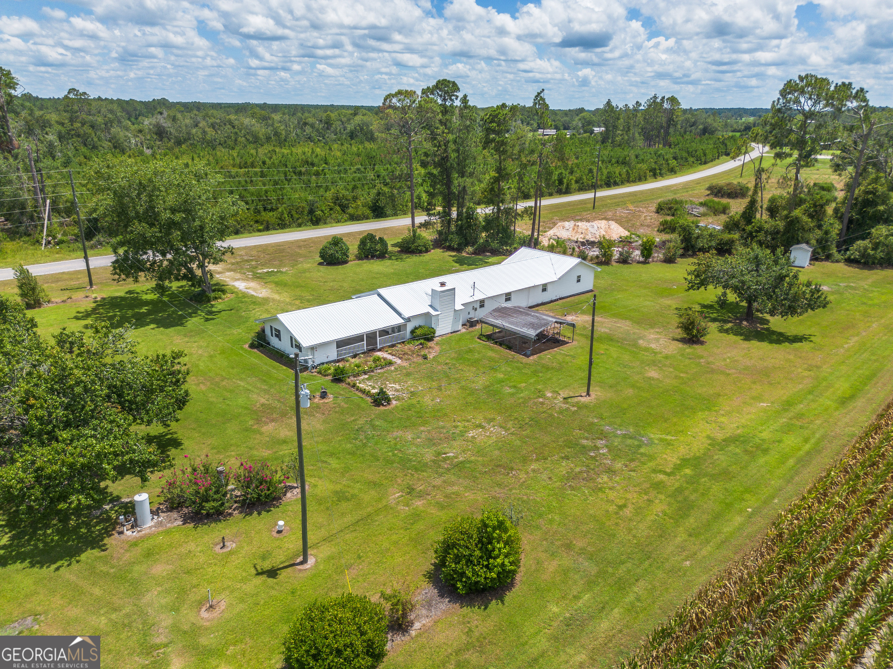 596 Teakwood Road Alma, GA 31510 - Photo 54 of 54 a view of a garden with houses