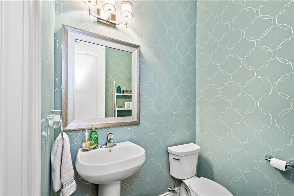 225 Meridan Street Pittsburgh, PA 15211 - Photo 11 of 25 a bathroom with a toilet sink and mirror