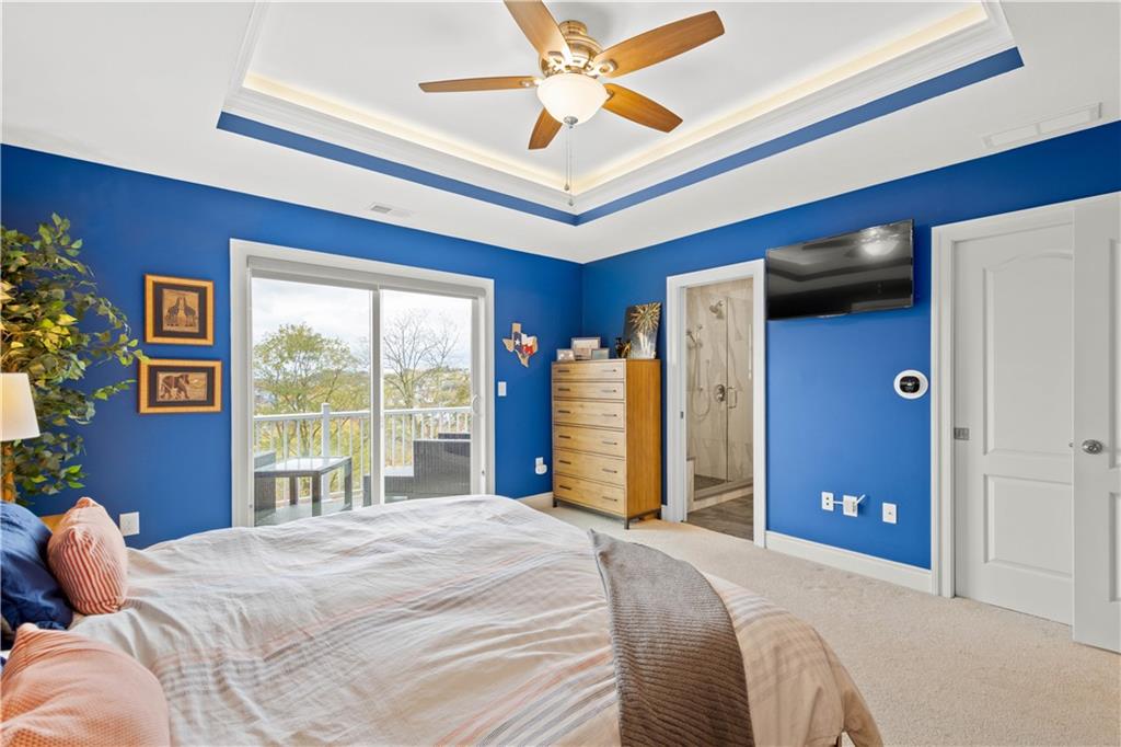225 Meridan Street Pittsburgh, PA 15211 - Photo 13 of 25 a bedroom with a large bed and a large window