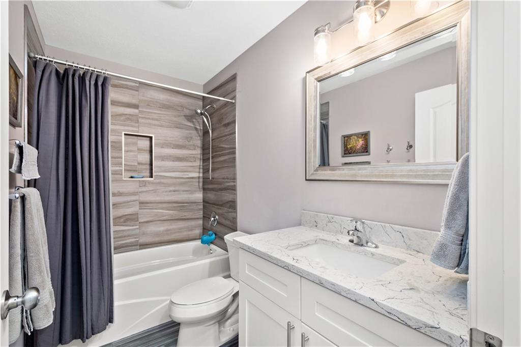 225 Meridan Street Pittsburgh, PA 15211 - Photo 18 of 25 a bathroom with a granite countertop sink toilet and shower