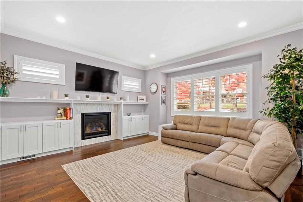 225 Meridan Street Pittsburgh, PA 15211 - Photo 4 of 25 a living room with furniture a flat screen tv and a fireplace
