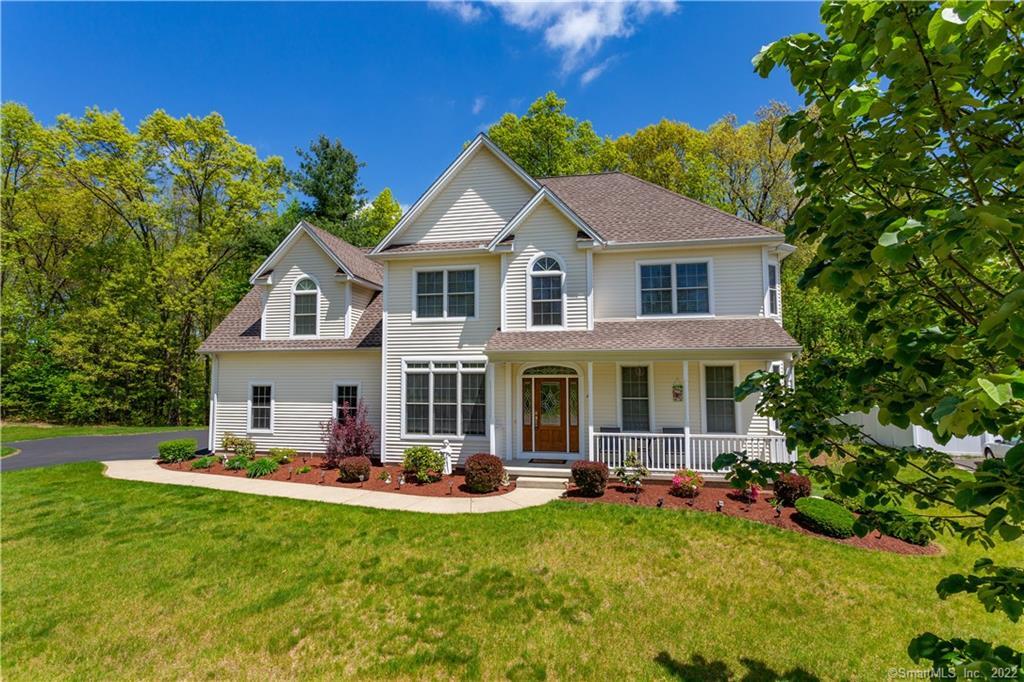 42 Privilege Road Bloomfield, CT 06002 - Photo 1 of 1 a front view of a house with swimming pool having outdoor seating