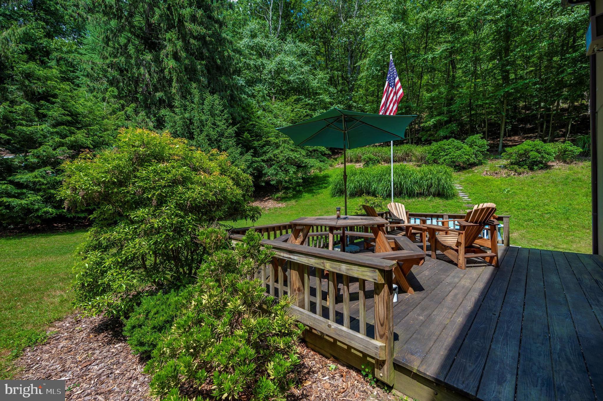 9301 Hamburg Road Frederick, MD 21702 - Photo 6 of 57 a view of a deck with furniture and a yard