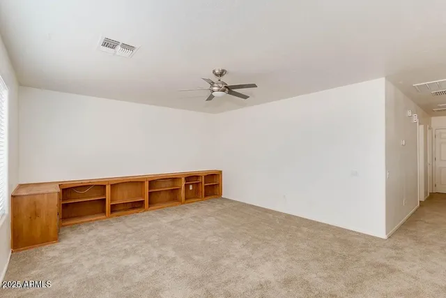 a spacious bathroom with a tub sink and mirror