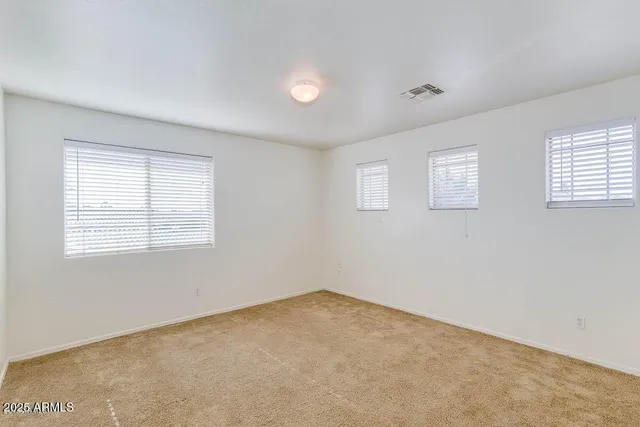 a view of a street with a car parked in front of it