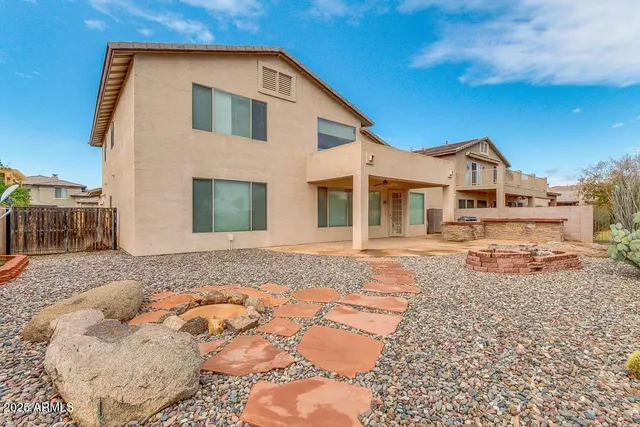 a view of a swimming pool with sitting area and slide