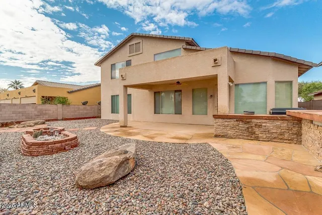 a view of a patio with a garden and plants
