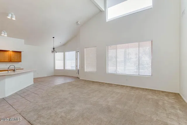 a kitchen with stainless steel appliances a sink dishwasher stove top oven and cabinets
