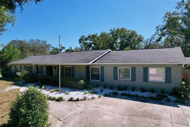 a view of a house with garden and plants