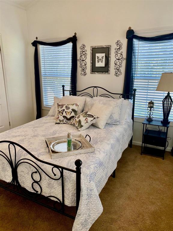 1425 Lone Star Road Celina, TX 75009 - Photo 28 of 40 Cottages A & B - Large windows fill the bedroom with natural light, creating a peaceful retreat that's comfortable and private. This relaxing atmosphere adds to the appeal for tenants, making these cottages an attractive addition to the property's established rental income.