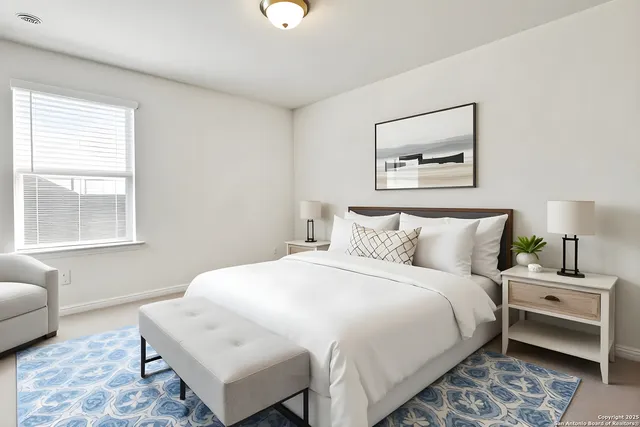 a bedroom with bed and a couch