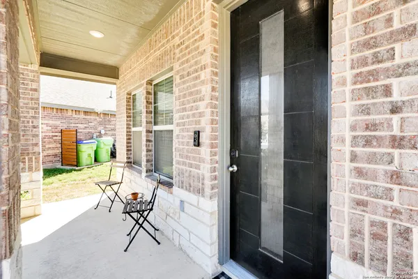 a view of balcony with wooden floor and outdoor seating