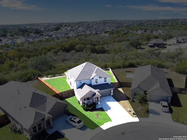 an aerial view of a house with a garden