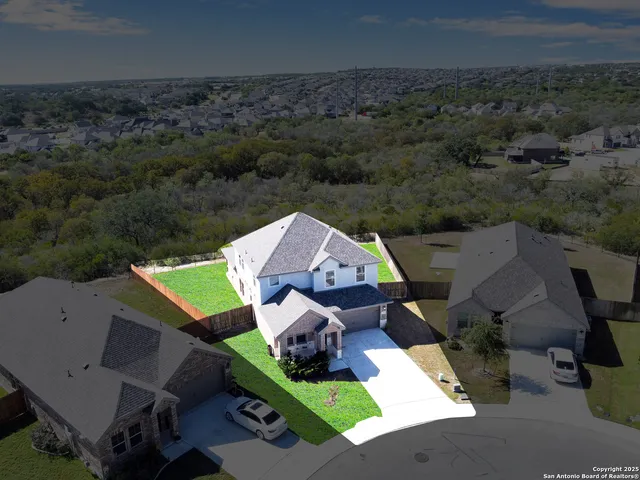 an aerial view of a house with a garden