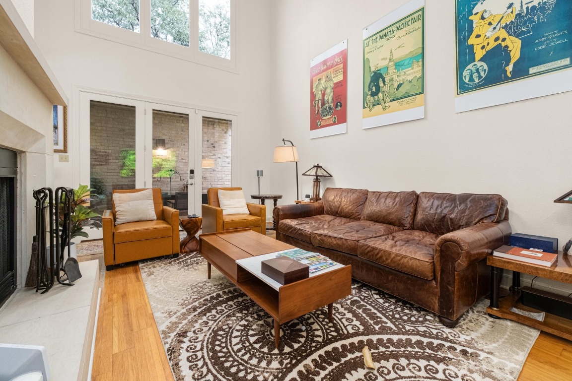 902 West 18th Street, Unit B Austin, TX 78701 - Photo 2 of 39 A beautiful living area with tons of natural light, freshly painted, high ceilings and access to the charming courtyard