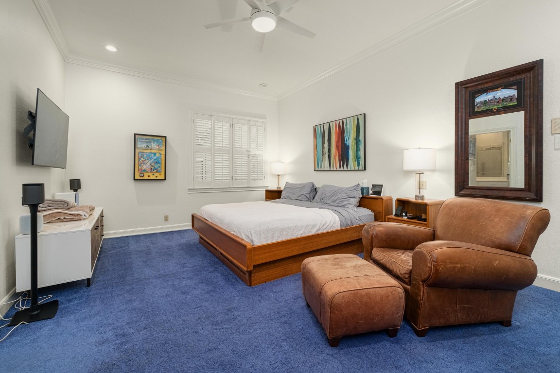 902 West 18th Street, Unit B Austin, TX 78701 - Photo 21 of 39 Primary bedroom with shutters, high ceilings, recessed lighting, freshly painted.