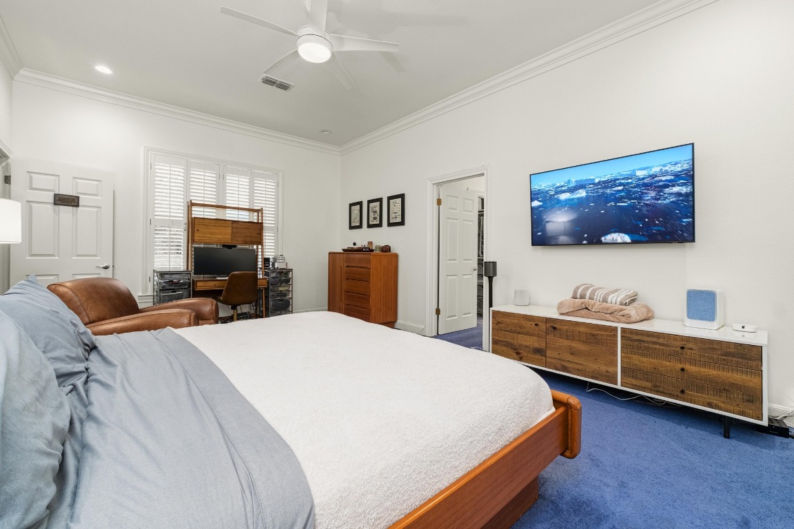 902 West 18th Street, Unit B Austin, TX 78701 - Photo 23 of 39 Primary bedroom with shutters, high ceilings, recessed lighting, freshly painted.