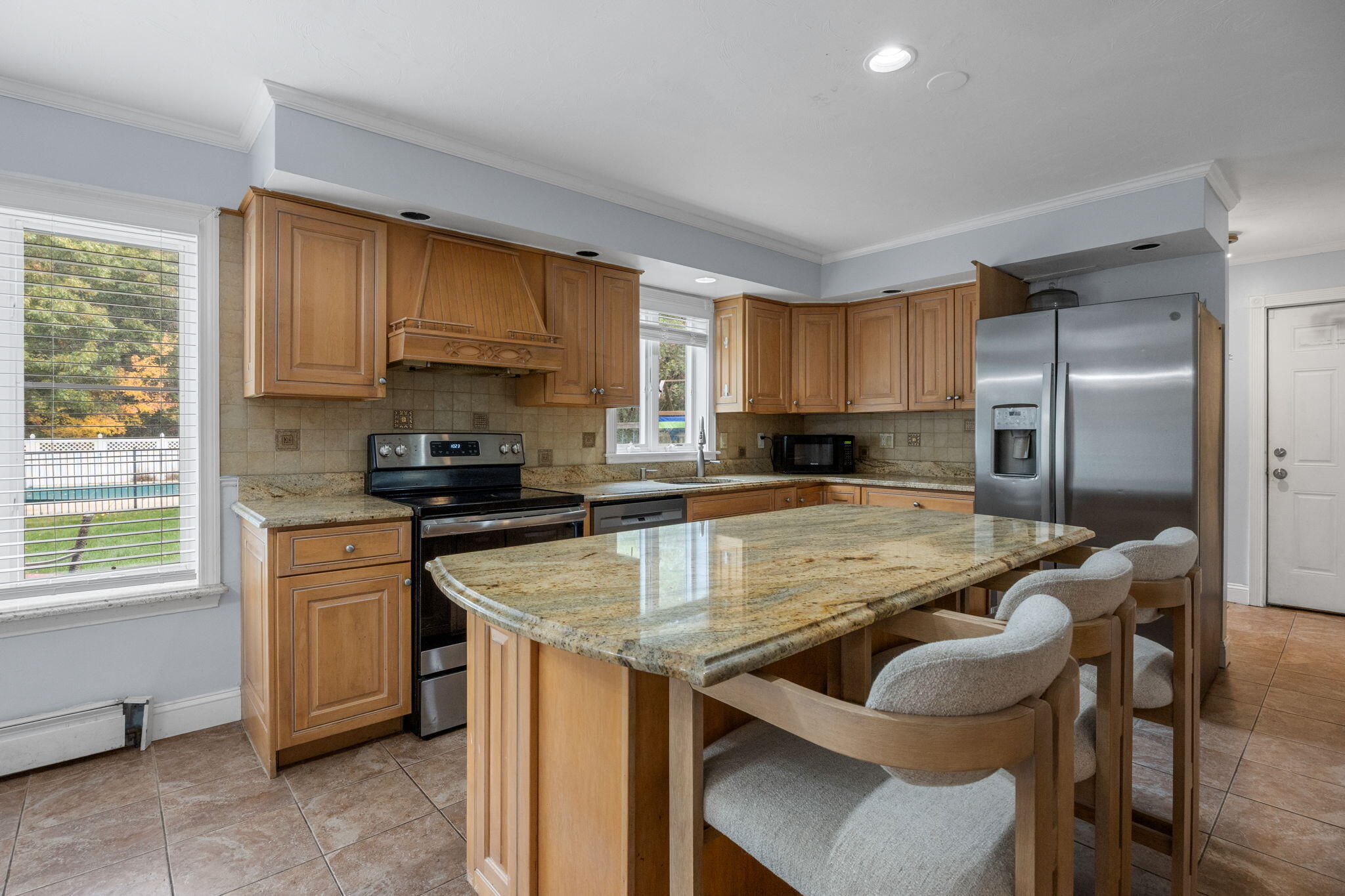 4 Knob Lane Buzzards Bay, MA 02532 - Photo 13 of 52 a kitchen with kitchen island granite countertop a sink stove and refrigerator