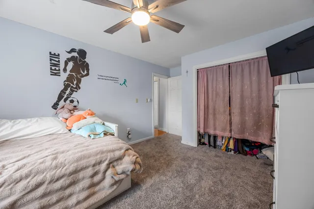 a view of staircase with wooden floor and a window