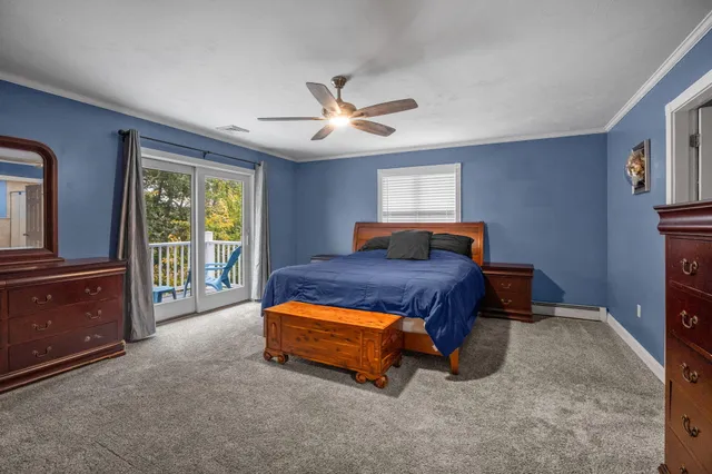 a spacious bedroom with a bed and a fireplace
