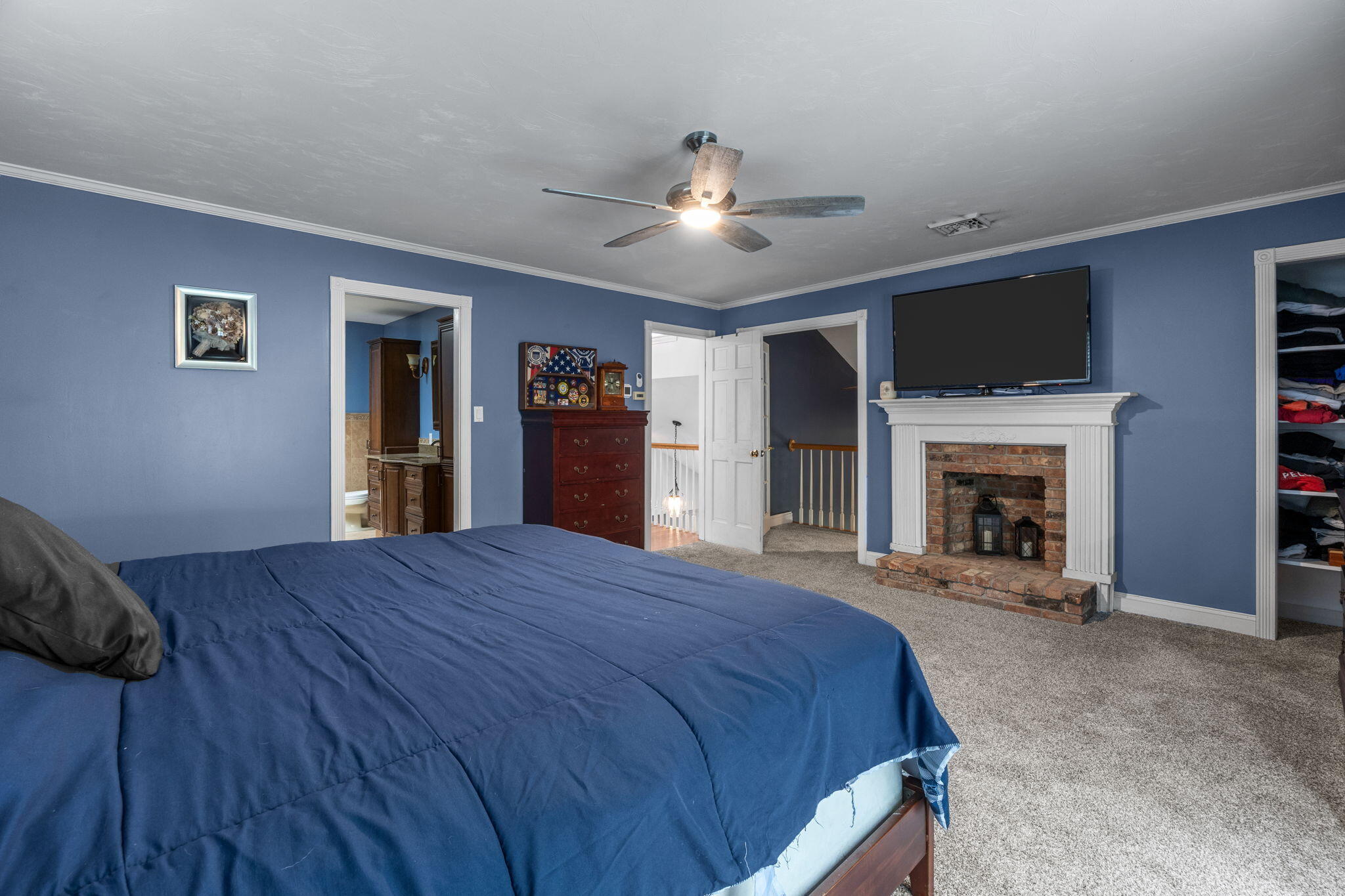 4 Knob Lane Buzzards Bay, MA 02532 - Photo 33 of 52 a spacious bedroom with a bed and a fireplace