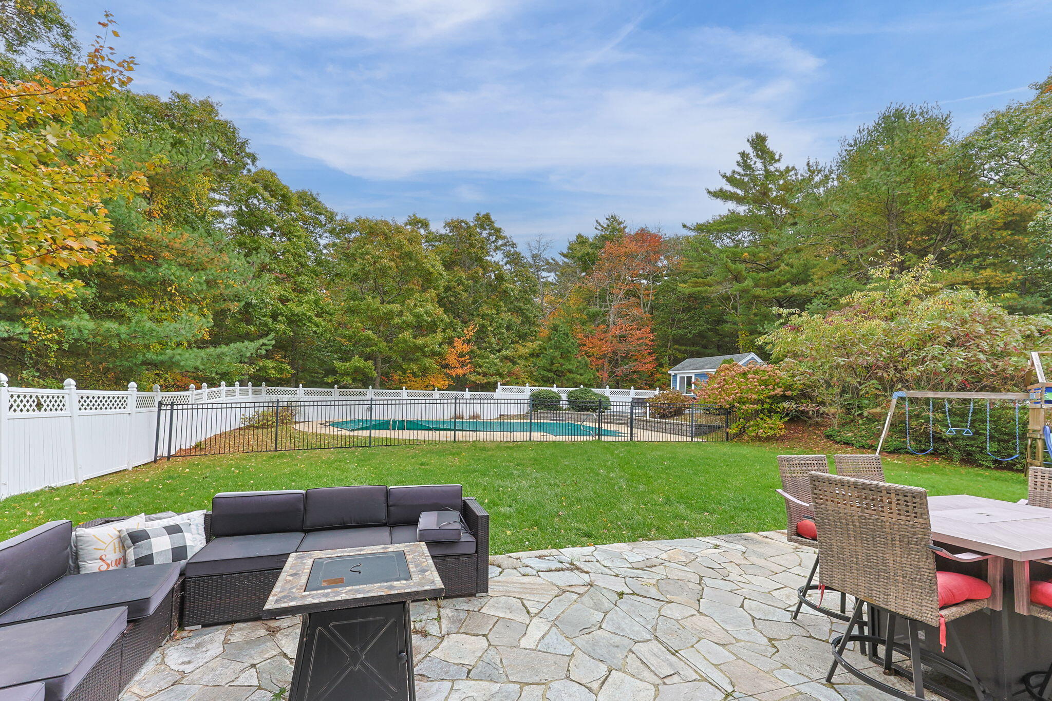 4 Knob Lane Buzzards Bay, MA 02532 - Photo 41 of 52 a view of a swimming pool and lounge chairs in back yard of the house